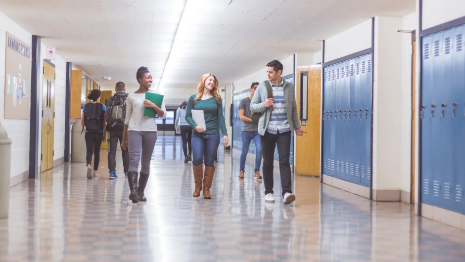 Middle school students walking in hallways during class time with supervised student movement between classrooms